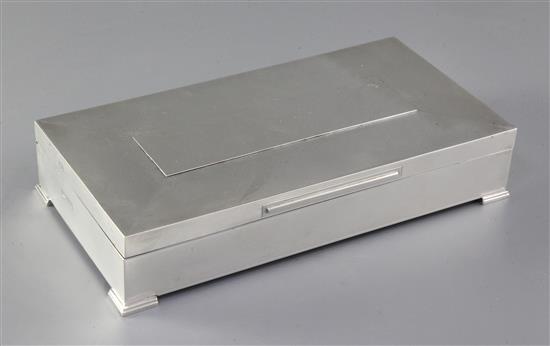 A 1960s engine turned silver rectangular cigarette box, 24.8cm.